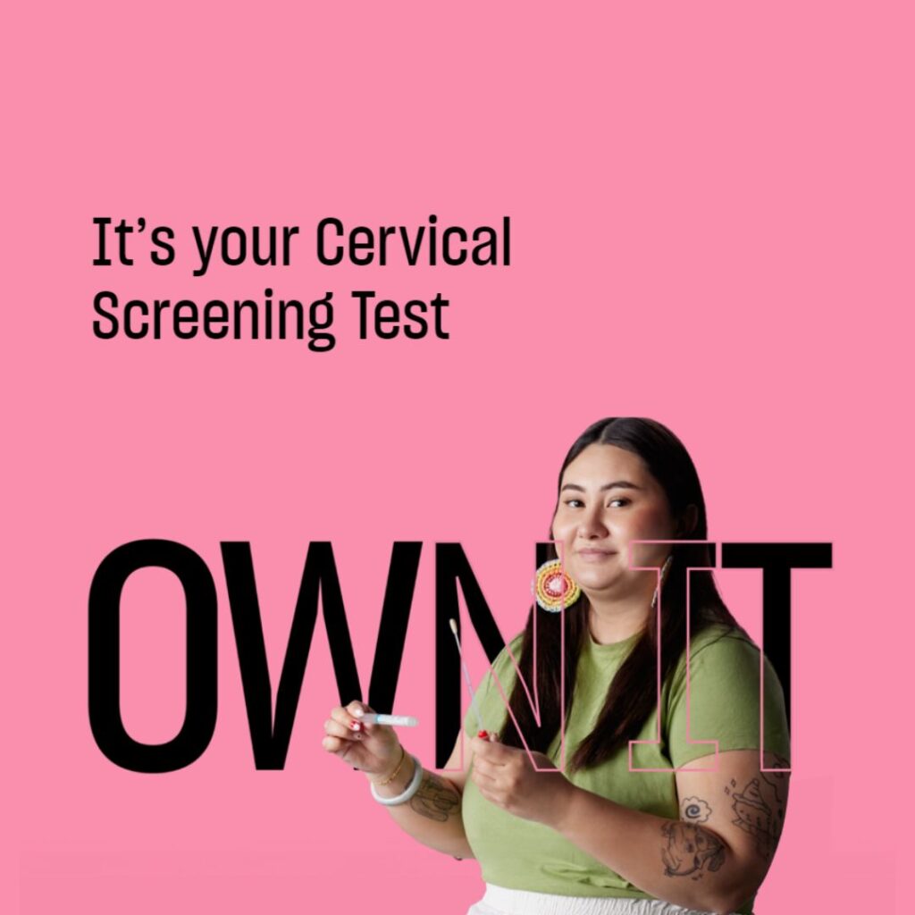 a Woman holding a Cervical Screening Text kit in a Pink Background with a text "It's your Cervical Screening Test Own It"
